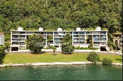 Modern apartment for sale in Lugano-Melide with breathtaking views of Lake Lugano