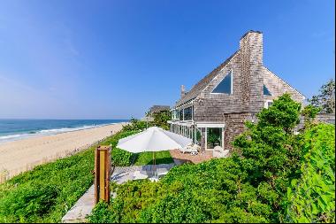 Immerse yourself in the ultimate luxury beachfront lifestyle with this stunning oceanfront
