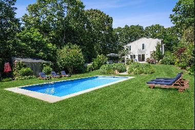 Beautifully landscaped half acre with pool. Double height living room, eat in kitchen and 