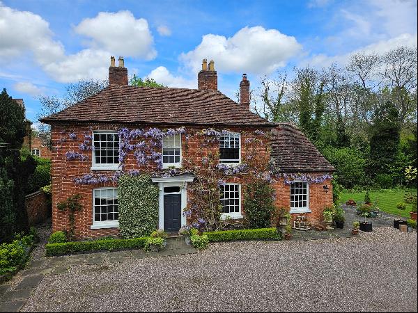 A beautiful Grade II listed Georgian country house, set within tree-lined manicured ground