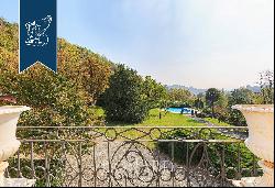 Historical noble estate surrounded by the panoramic landscape of Piedmont's hills