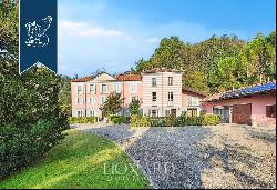 Historical noble estate surrounded by the panoramic landscape of Piedmont's hills