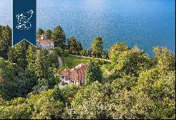 Exclusive lake-facing property with a small private beach and an exclusive dockyard