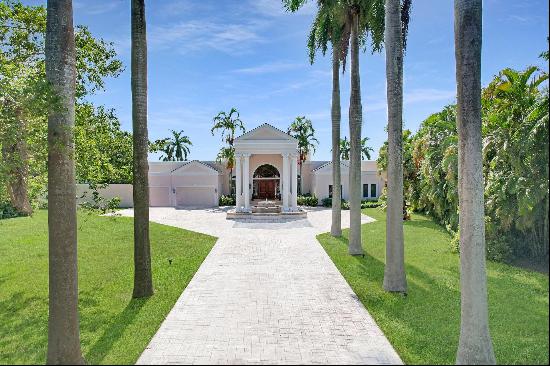 LAKEFRONT ESTATE: As you approach this incredible estate on nearly 1.25 acres, you are wel