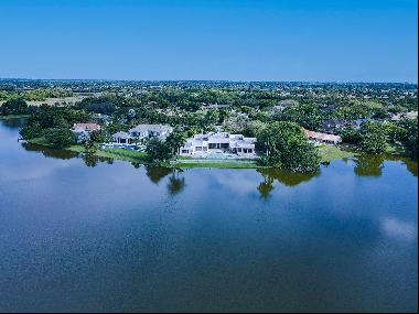 LAKEFRONT ESTATE: As you approach this incredible estate on nearly 1.25 acres, you are wel