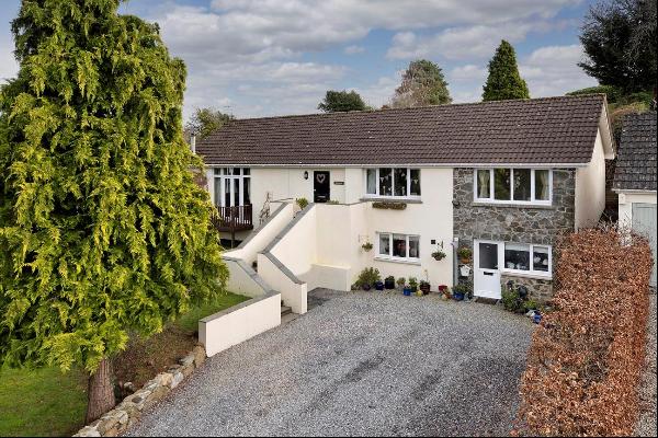 A really exciting family home set in the middle of this pretty village with 1¼ acres of gr