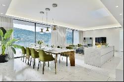 Lugano-Bissone: exclusive penthouse apartment for sale with stunning views over Lake Luga
