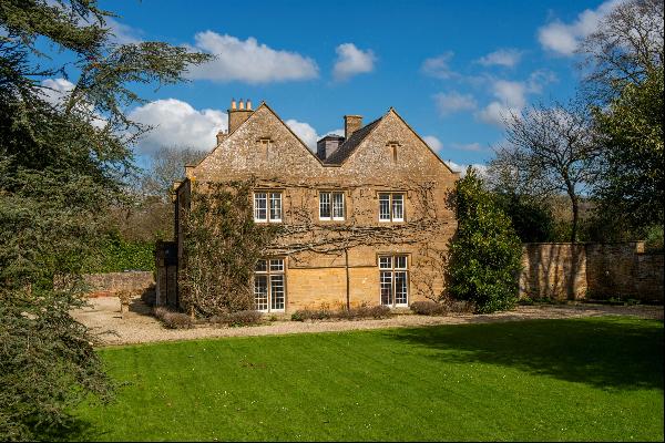 A Georgian former rectory & cottage set in about 7 acres of beautiful grounds amidst unspo