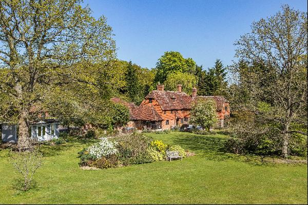A Grade II listed six bedroom home set in an idyllic location with secondary accommodation