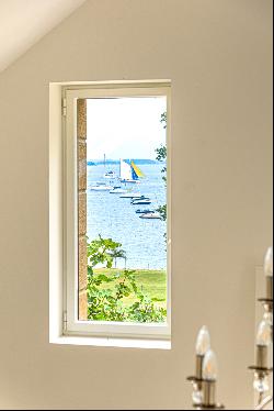 The feet in the water, breathtaking view of the Gulf of Morbihan and its islands