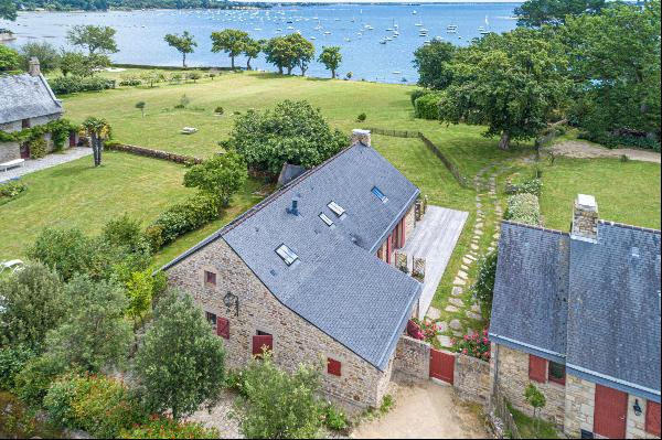 The feet in the water, breathtaking view of the Gulf of Morbihan and its islands