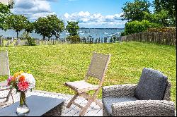 The feet in the water, breathtaking view of the Gulf of Morbihan and its islands