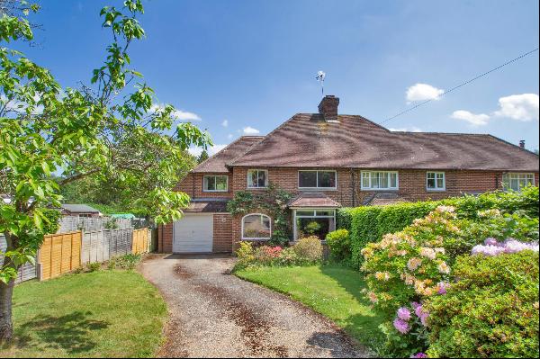 A semi-detached family home with  wonderful outside space and views, ideally located for l