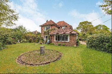 A spacious family home set centrally within a substantial and private garden with potentia