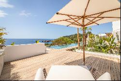 Stunning sea front villa in the private community of Roca Lisa with access to th