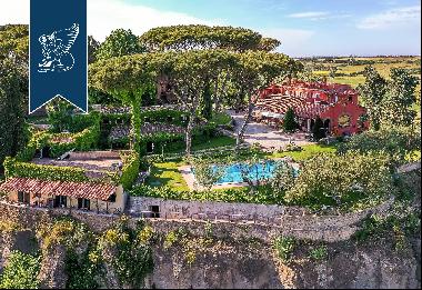 Hamlet with a typical turret for sale near the most famous beaches of Rome's coast