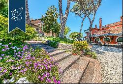 Hamlet with a typical turret for sale near the most famous beaches of Rome's coast