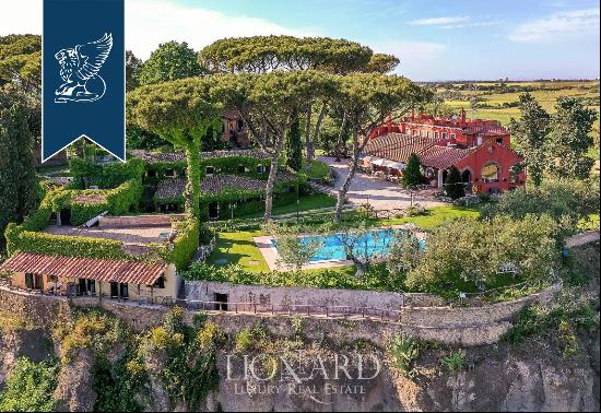 Hamlet with a typical turret for sale near the most famous beaches of Rome's coast