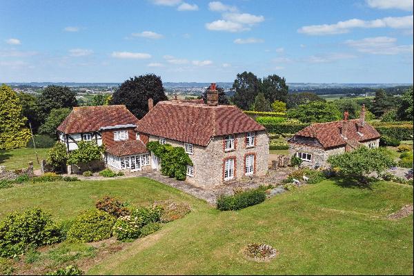 A historical and ideally located Grade II listed manor house set in approximately 10 acres