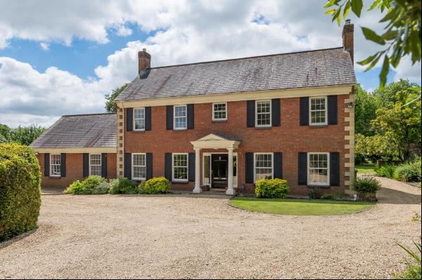 An impressive and spacious detached 5 bedroom family home, with outbuildings, a tennis cou