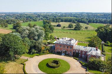 A handsome Grade I listed Georgian country house in a beautiful parkland setting on the ed