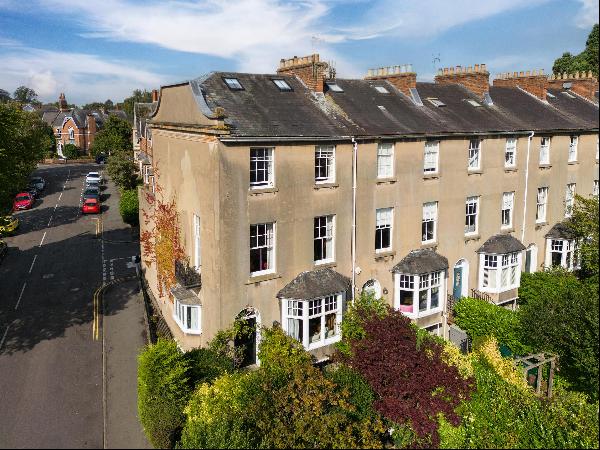 A spacious Regency townhouse occupying a prominent corner position, with easy reach of Lea