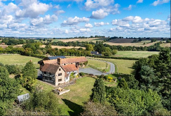 An important Jacobean Manor house with a beautiful converted barn, and substantial range o