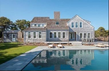 Welcome to the perfect Nantucket compound! Encompassing almost 2 acres, this property has 