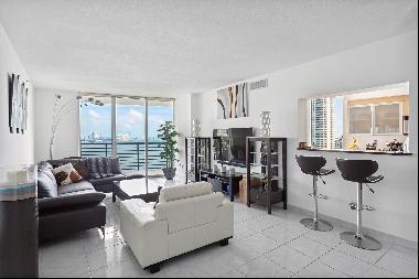 Experience the pinnacle of Miami living in the premier line at One Miami. This 3-bedroom g