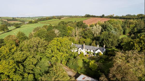 A gorgeous Grade II listed manor house set in a magical location, offering 4 acres, a matu