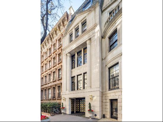 Grand and lavish, this limestone townhouse, on a highly coveted block known for its mag