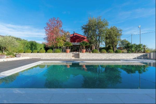 Modern hillside villa with pool and park