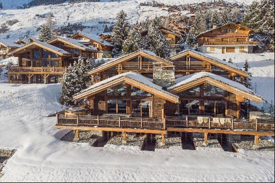 The Rocks Estate is a complex of 3 prestigious ski-in ski-out chalets finished to an exc