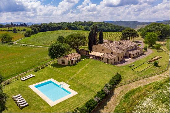 A romantic estate perched atop the undulating hills in Tuscany