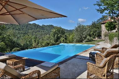 An idyllic villa within a green, Tuscan landscape