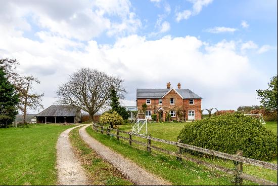 Impressive country home with secondary house, private grounds and land, all with far-reach