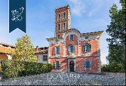 Between Italy and Switzerland: historical estate for sale with a villa, a tower, an outbui