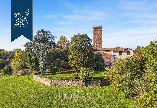 Between Italy and Switzerland: historical estate for sale with a villa, a tower, an outbui