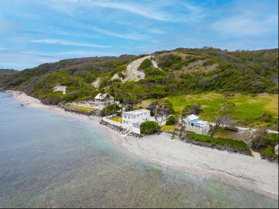 Beachfront house located along the water's edge on Bath Beach on the East Coast of Barbado