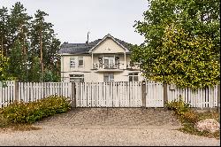 A house in Baltezers with a view of the lake and the pine park