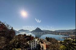 Modern villa for sale in Ruvigliana with large panoramic terrace overlooking Lake Lugano