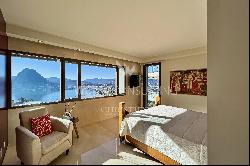 Modern villa for sale in Ruvigliana with large panoramic terrace overlooking Lake Lugano