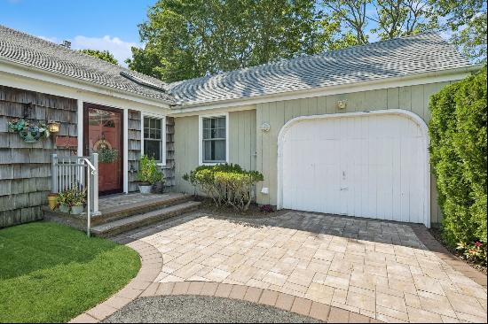 Your Summer Getaway awaits at this spacious Hampton Bays Ranch home located south of the h