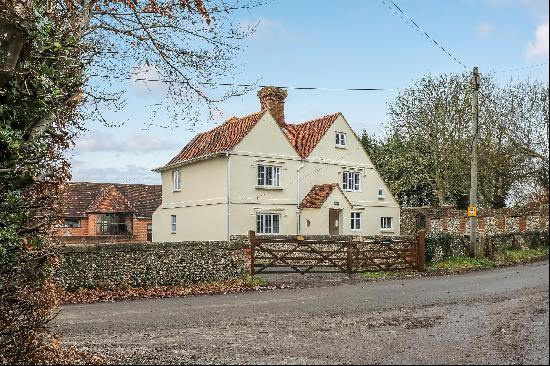 A Grade II listed farmhouse with 17th century origins in need of renovation sitting in abo