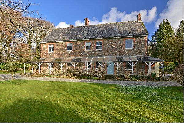 Family home with generous gardens on the edge of Dartmoor. An extra 0.43 acres with a sepa