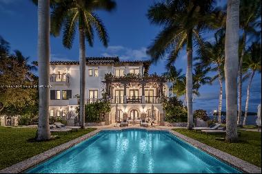 Perfectly set on a ½ acre +, bayfront estate, this 3-story Villa is the epitome of sophist