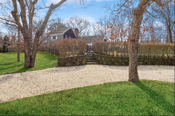 This Classic Hamptons home offers a huge, open living room with cathedral ceiling and dini