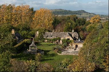 Enchanting Cotswold stone house set in landscaped gardens with distant views and land