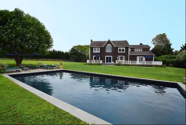 Summer in Bridgehampton in this shingled, five-bedroom, five-bath, two-story pristine resi