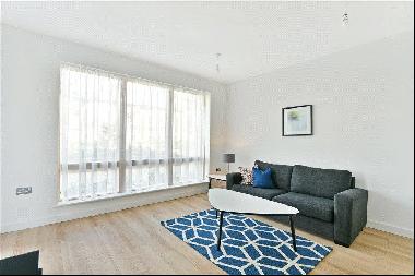 A bright two bedroom apartment with access to a large patio terrace in this modern develop